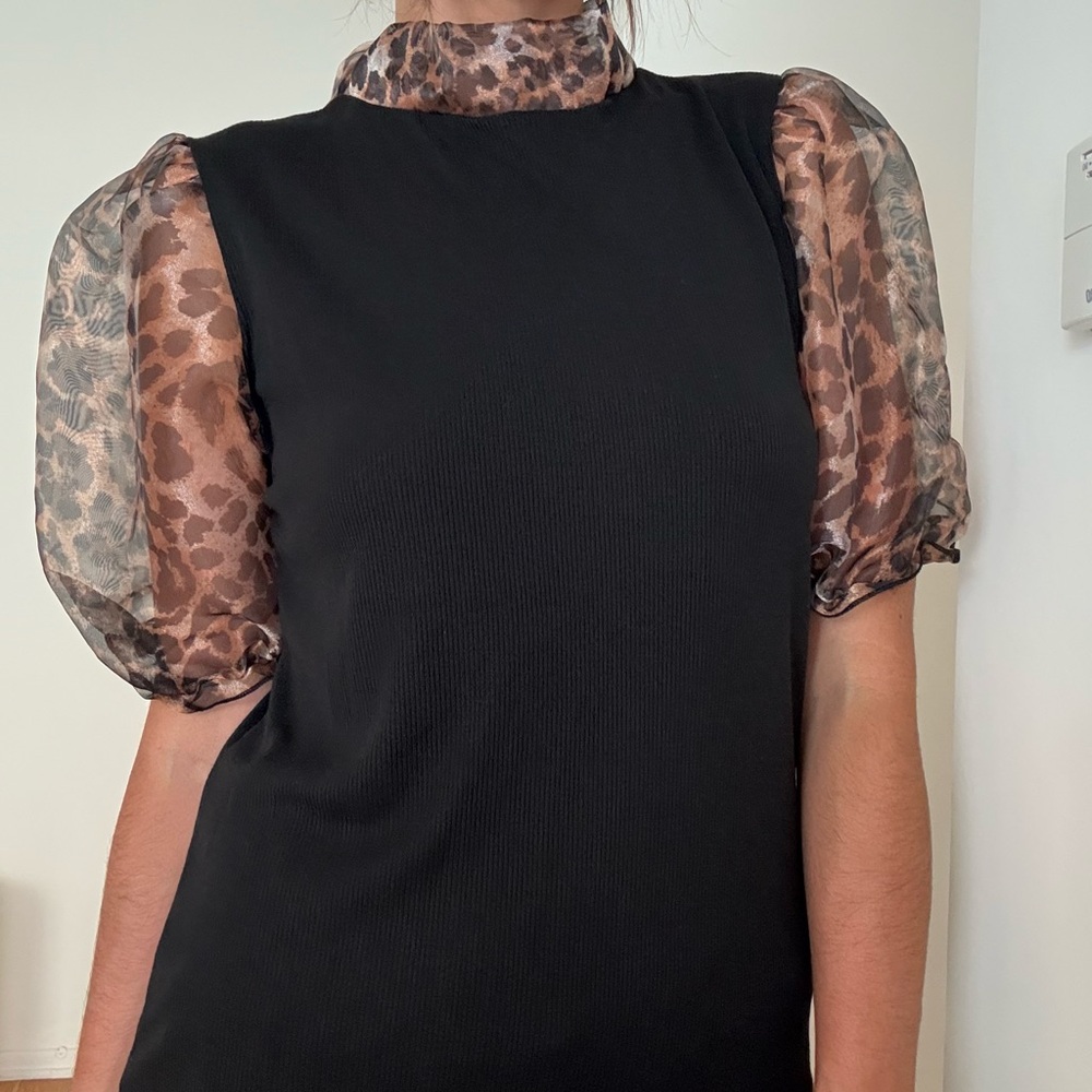 Elegant Black Top with Sheer Leopard Sleeves